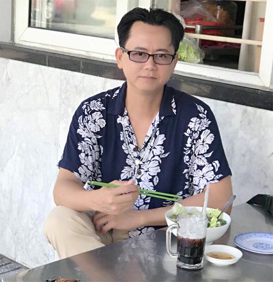 Viet Kieu sitting at coffee shop in Vietnam