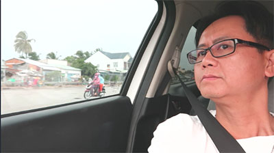 Vietnamese man in a car at Ho Chi Minh city Vietnam