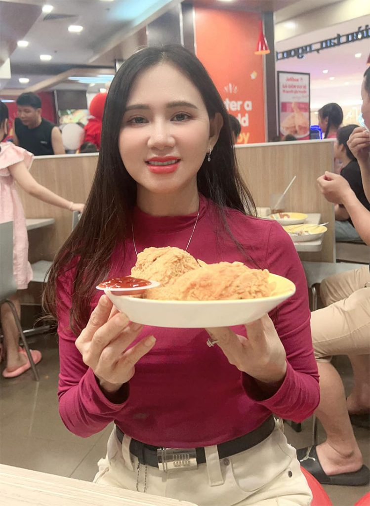 Vietnamese woman holding a plate of food